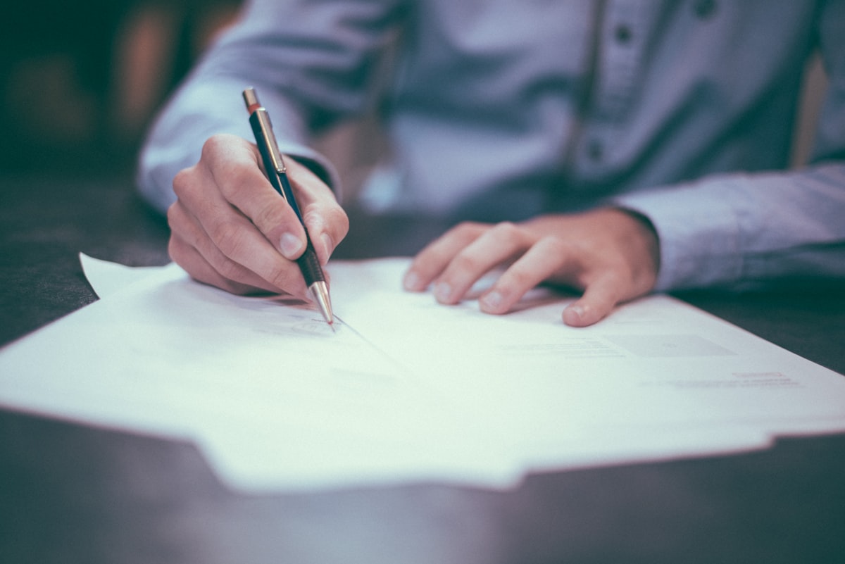 Signing employment and visa paperwork